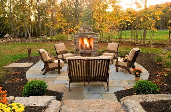 Outdoor stone barbecue with surrounding mulch floor