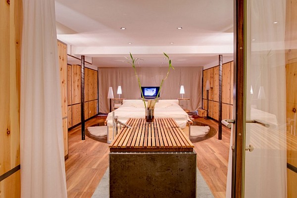 stylish bedroom with wooden furnishings - zermatt, switzerland