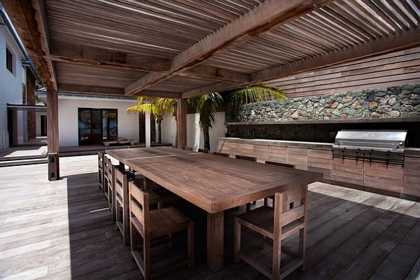 stylish outdoor patio with wooden table and chairs