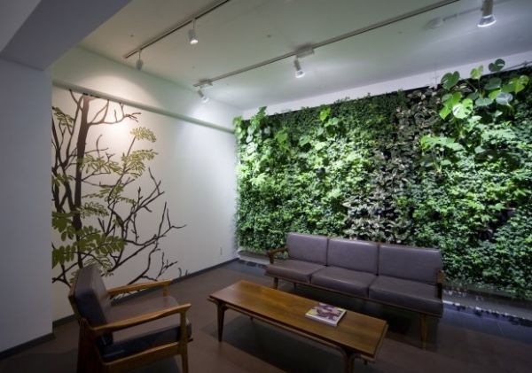 Beautiful green wall along with wall art for the lounge