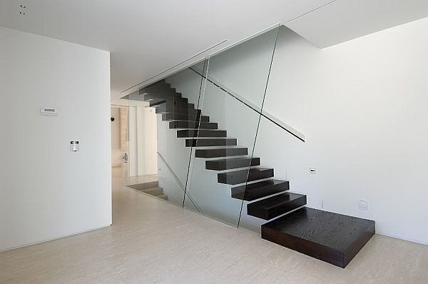 Black floating staircase design against a white backdrop