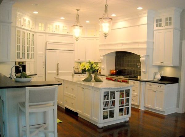 Bookcase with glass doors in the kitchen perfect for all your cookbooks!