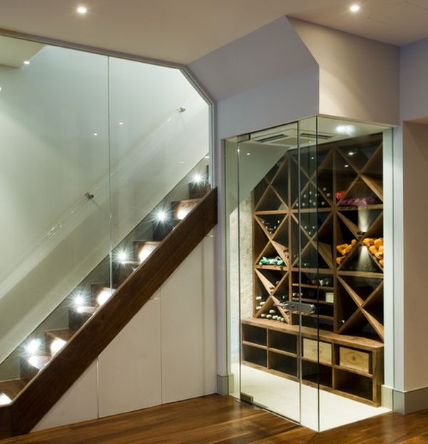 Contemporary temperature-controlled wine room next to the stairs