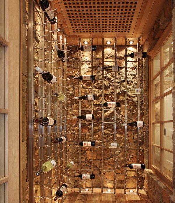 Cool wine racks set against a stone backdrop give this cellar an artistic appeal