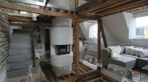 Cozy fireplace with logs of wood stacked beautifully next to it