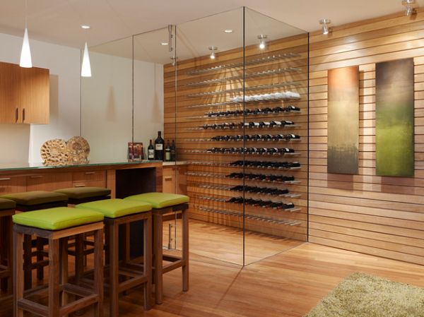 Floor-to-ceiling glass walls employed in this cool contemporary wine cellar