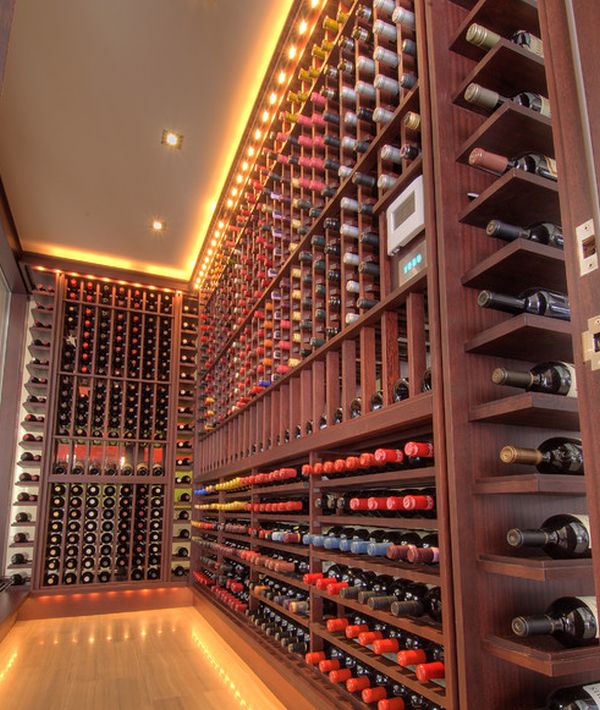 Gorgeous track lighting illuminates this wine cellar