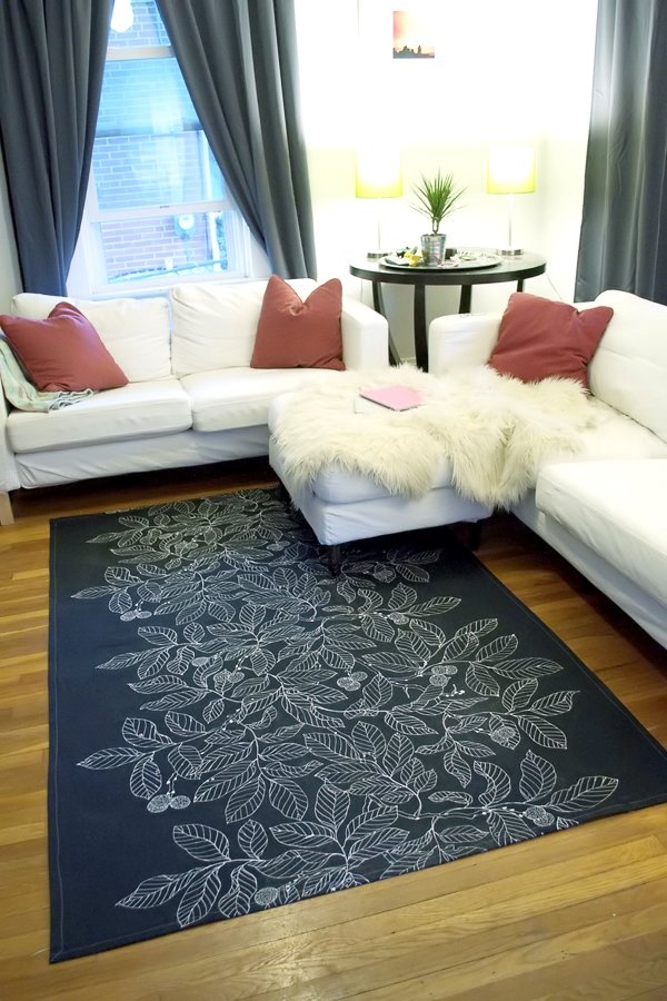 Gray and white stenciled leaf rug