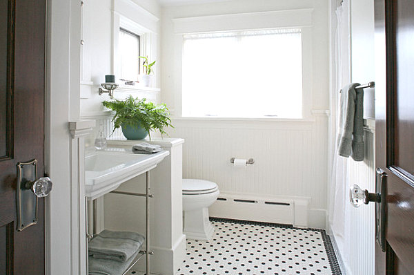 Green fern in a crisp white bathroom