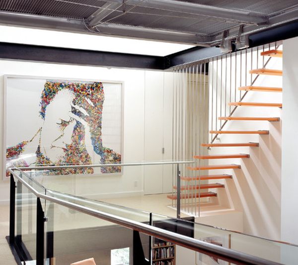Interesting art work and lovely floating stairs combine to give this home a chic look