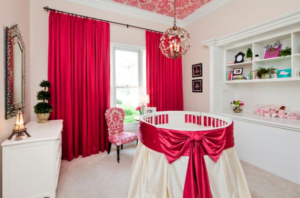 Lovely accents of red and white style up this cute round crib