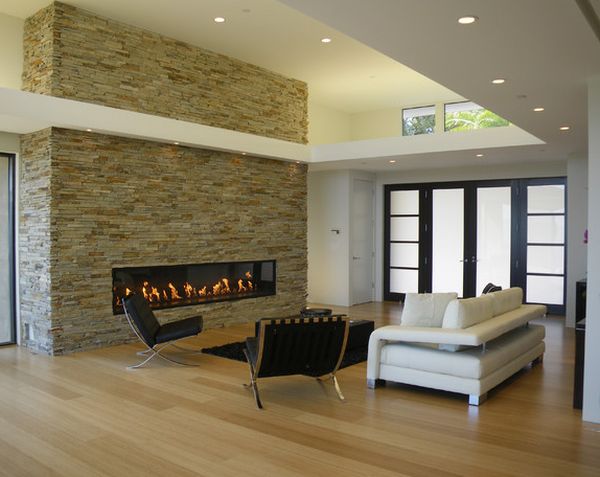 Lovely linear fireplace set in a stone wall