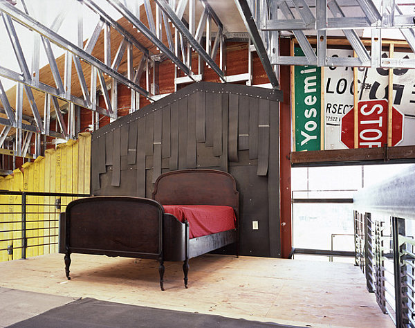 Modern bedroom with salvaged metal signs