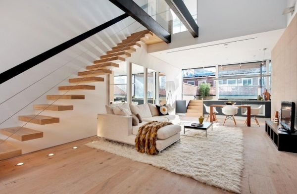 Modern living room with stylish floating staircase