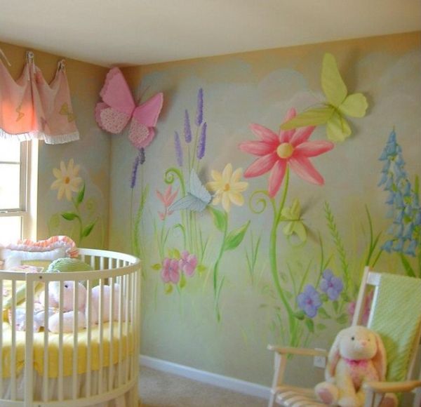 Oversized flowers and lovely wall art make this a vivacious nursery