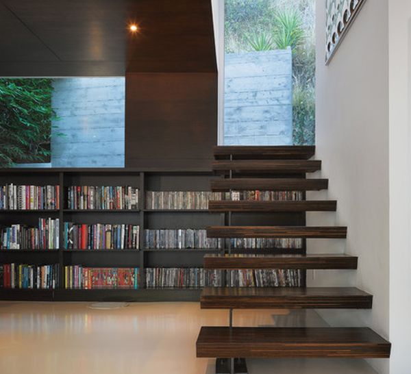 Sleek and stylish floating stairs connect the home with the backyard