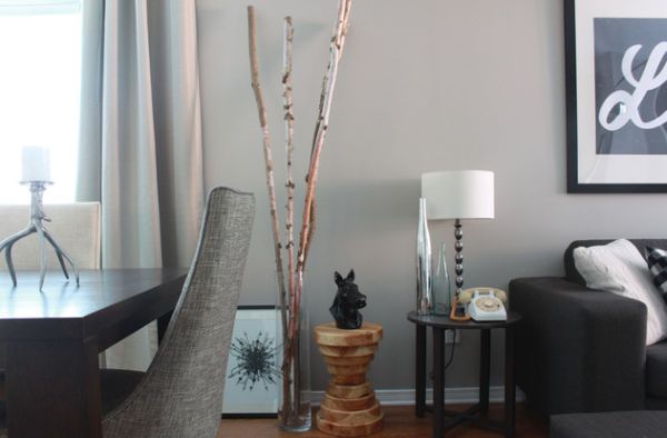 Transparent floor vase showcases real birch branches