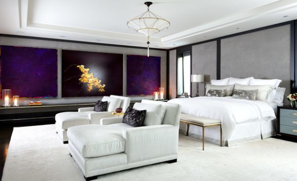 Twin chaise lounge chairs in white fill up this contemporary bedroom beautifully