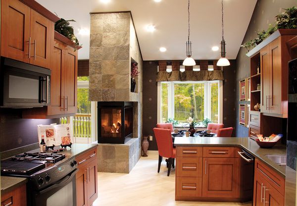 Unique fireplace surrounded by stone and glass