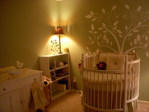 Warm hues and gorgeous wall art add to the beauty of this nursery