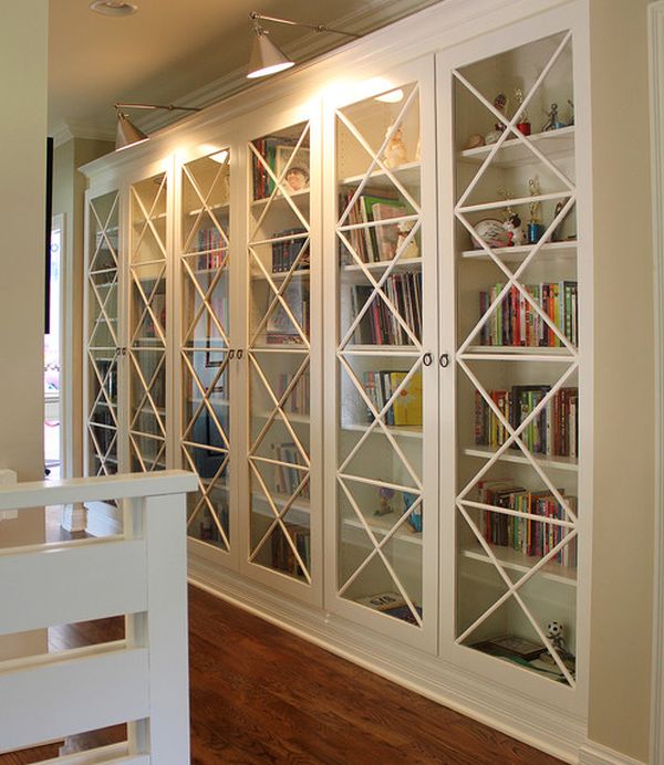 X motif custom designed glass doors give these bookcases an inimitable look