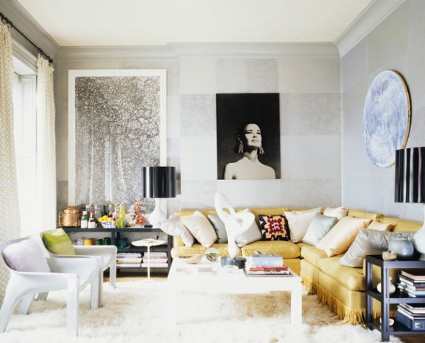 A black lampshade stands out in the living room with an all-white backdrop