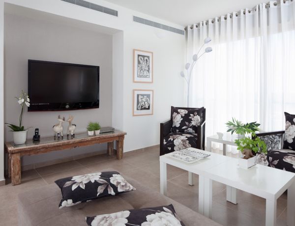 Black and white pattern living room with a floral-styled floor lamp