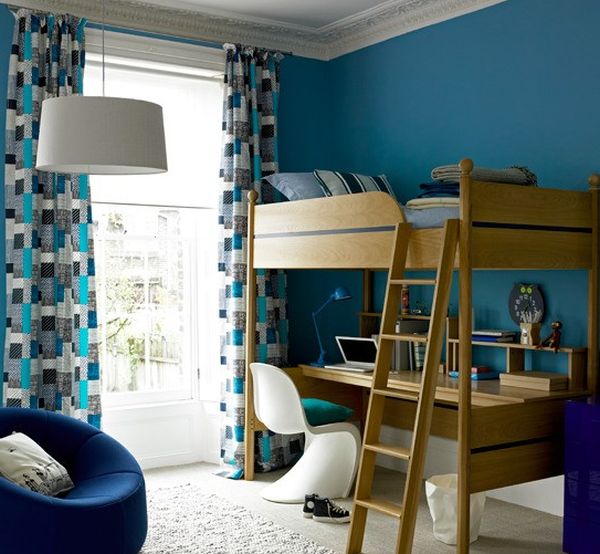 Bunk beds add wooden texture to a room in cool white and bold blue