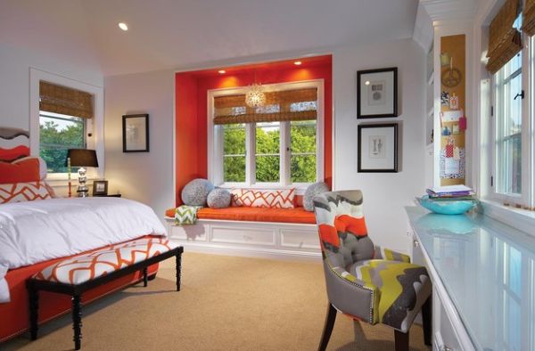 Bursts of orange in the bedroom create a playful vibe