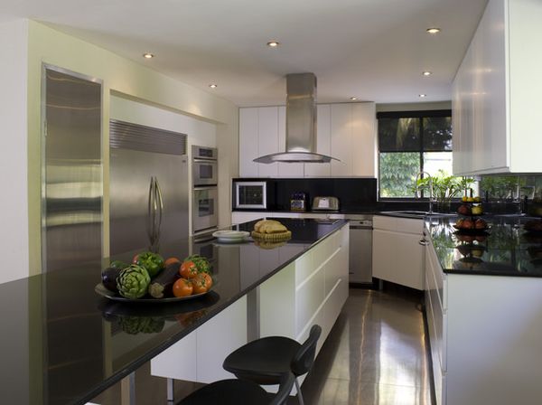 Chic modern kitchen with polished surfaces and a smart corner sink unit