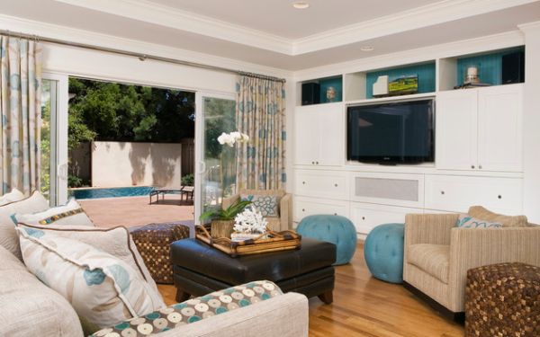 Colorful curtains and sliding glass doors separate the lively living room from the backyard