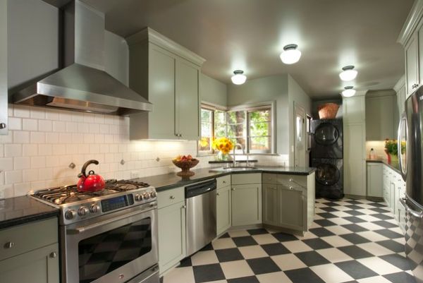 Contemporary kitchen in gorgeous shade of green with a daft corner sink