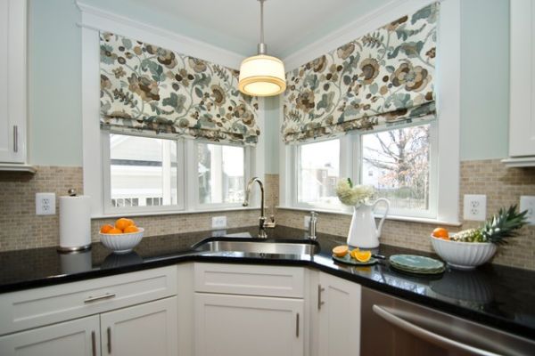 Control the amount of light you need while working at the corner sink with lovely curtains