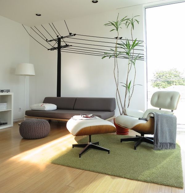 Cool wall decals make a beautiful backdrop for the Eames Lounge and Ottoman