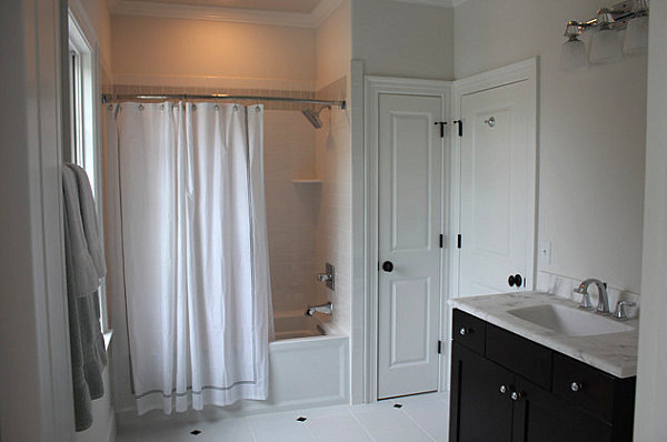 Cultured marble countertop in a crisp white bathroom