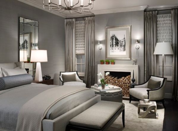 Donghia floor lamp along with table lamp and a lovely chandelier illuminate this exquisite contemporary bedroom