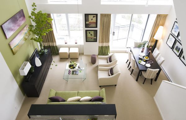 Drapes and couch in accent wall color highlight the light moss green in the living space