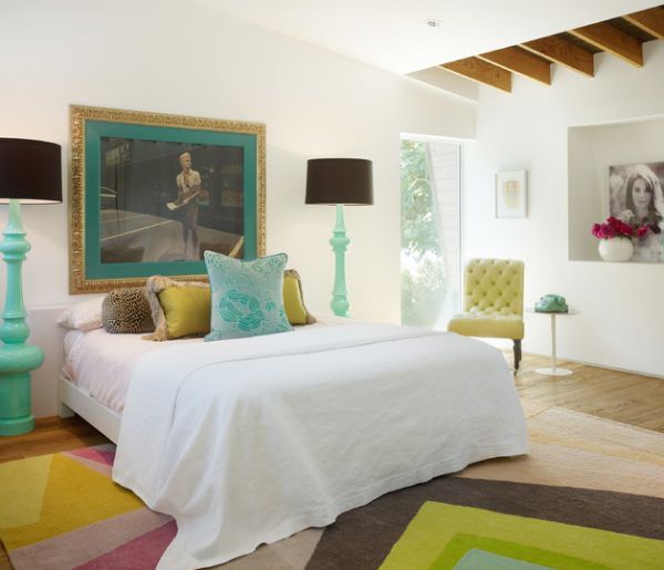 Eclectic bedroom with matching floor lamps in turquoise blue