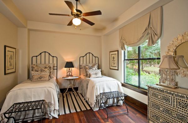 Elegant bedroom with table lamp between the beds stealing the spotlight!