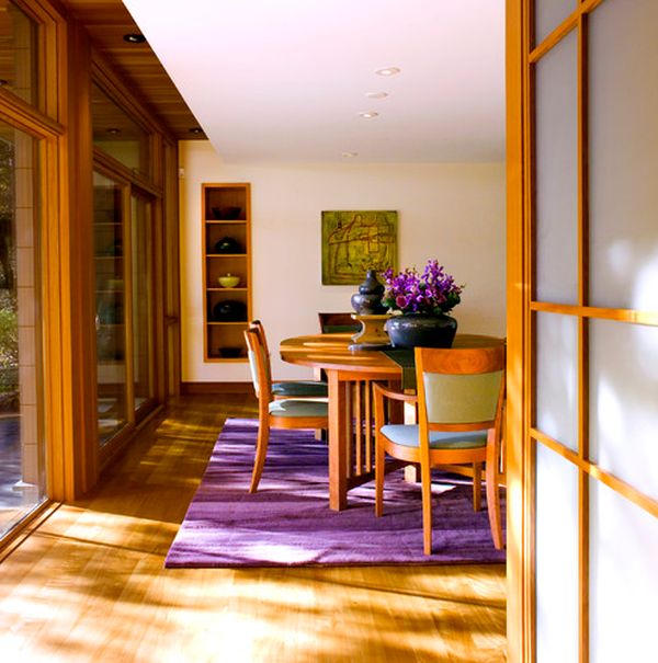 Fabulous dining room covered in wooden surfaces gets a fresh makeover with purple accents