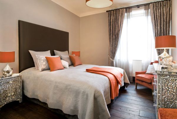 Lampshades in orange light up this modern bedroom beautifully