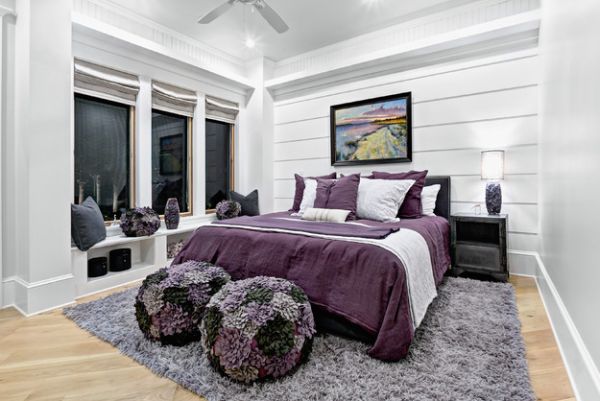 Lovely blend of various shades of purple and violet set against grey walls in the bedroom