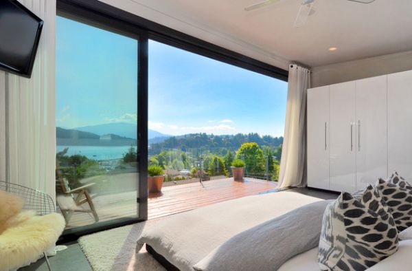 Modern bedroom with a stunning view thanks to sliding glass doors