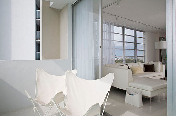 Modern white chairs on a Miami balcony