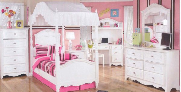 Numerous storage units help keep the mess at bay in this cute girls' bedroom