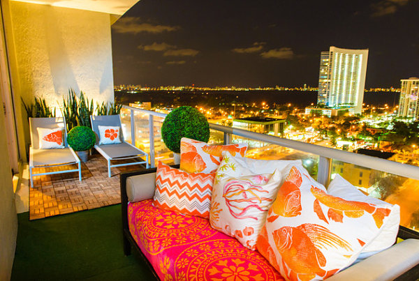 Plants and colorful seating on a modern balcony