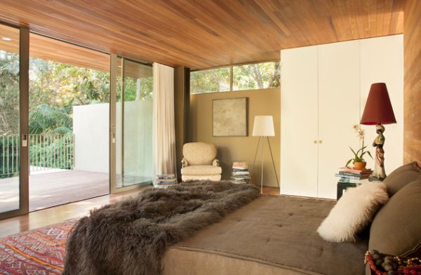 Plush bedroom separated from the balcony using sliding glass doors