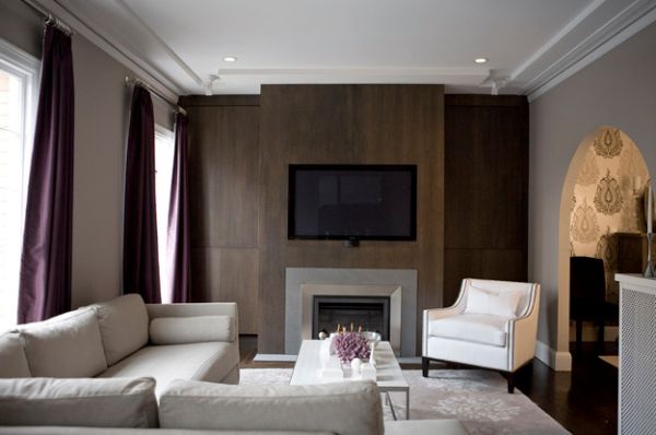 Purple drapes bring sophistication to this stylish living room in muted tones