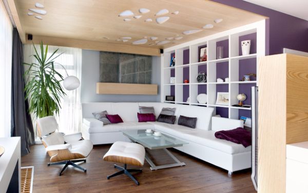 Purple on the walls and the Eames Lounger add elegance to the space