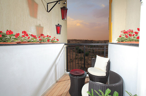 Red flowers on a narrow balcony